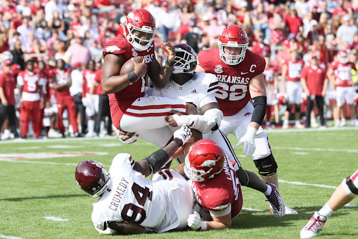 Oct 21, 2023; Fayetteville, Arkansas, USA; Arkansas Razorbacks quarterback KJ Jefferson (1) is tackled by Mississippi State Bulldogs defensive tackle Nathan Pickering (22) during the second quarter at Donald W. Reynolds Razorback Stadium. Mandatory Credit: Nelson Chenault-USA 